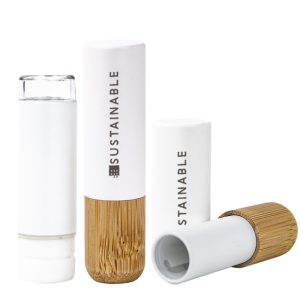 Two-tone natural bamboo empty lip balm tube with a white sprayed upper section and natural bamboo base. Features a PETG refillable inner core, 3.5g capacity, and patented design.