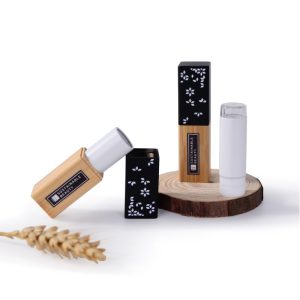Natural bamboo lip balm container with white spray-painted base, engraved logo, and refillable inner core. 3.5g capacity, patented design.