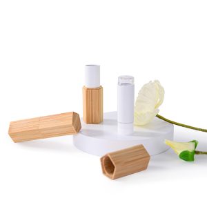 Pentagonal natural bamboo lipstick tube with PETG refillable inner core. 3.5g capacity, patent pending, ideal for lipstick, lip balm, or herbal balm packaging.