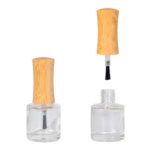 Empty glass nail polish bottle with bamboo cap and attached brush – eco-friendly refillable 10ml packaging